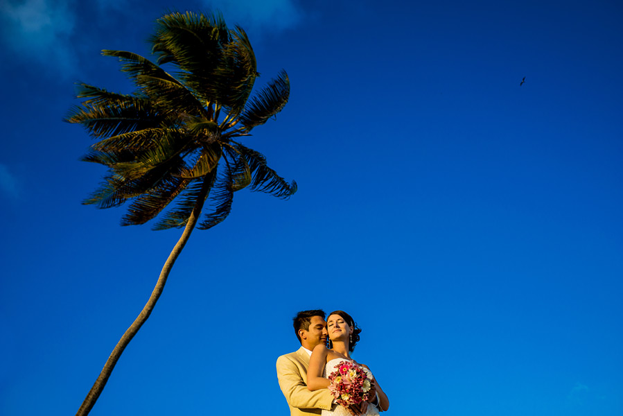 Blue skies and palm trees in Belize!  Coco Beach Resort Wedding.  Belize wedding photographers, Leonardo Melendez Photography.